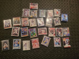 Hundreds of cards, base and inserts. Football and baseball