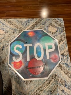 Hand Painted stop sign with planets on it