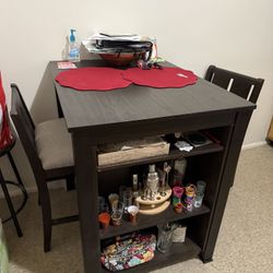 brown bar table and chairs