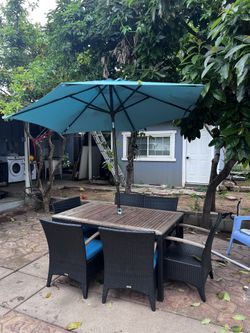 Old Table ,blue Umbrella, 2 Missing Cushions ,6 Seats,sturdy