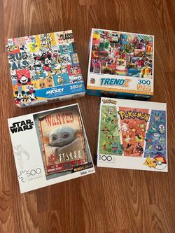 4 jigsaw puzzles.  500, 300 and 100 pieces. All in hardly used condition