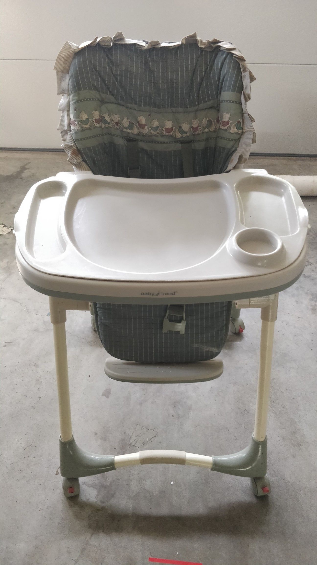 High chair. Tray is removable. Top of tray is also removable for easy cleaning. Back reclines to several positions.