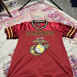 JWM U.S. Marines football jersey featuring embroidered graphics and a red polyester design