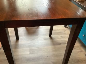 Dark solid wood dining table