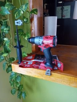 Milwaukee. 18 V. New.  Fuel.  Hammer Drill.   2 Speed.   1/2".  W/  Handle 