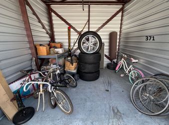 Auction Unit 371 7/16-Garage Items, Pacer Rims, Auto Parts, Boxes, Camping Gear, Exercise Equipment, Totes, Tubs