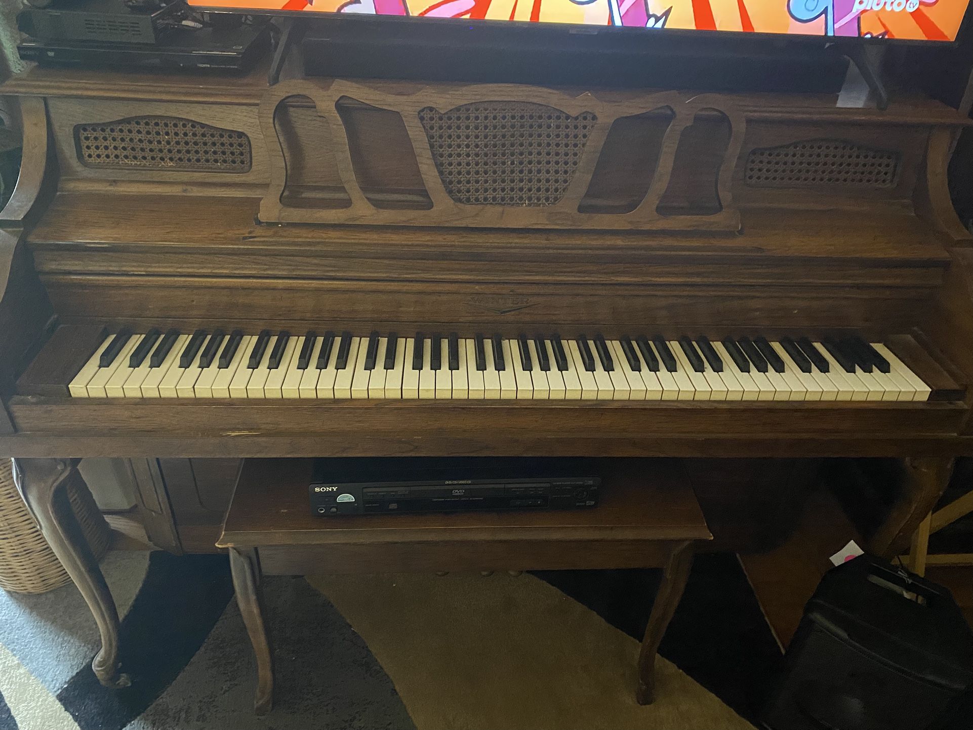 Large Piano With Large Wooden Stool