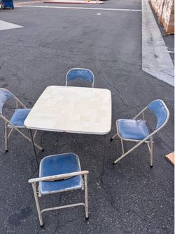 4 Folding Chairs and Folding Table