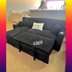 Black corduroy sectional sofa with pullout bed with cup holders 