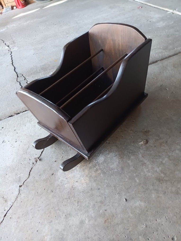 Cradle magazine rack.