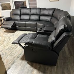 New black faux leather reclining couch