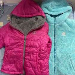Two jacket for girls blue and pink  new ,size 10-12  both side can wear   Two jacket for $70