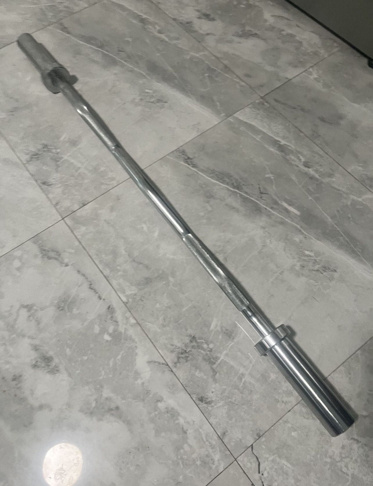 Brand new in wrapper ez curl barbell bar for Olympic weights plates for 2 inch slot of weights also have Olympic 45s new in box for additional price