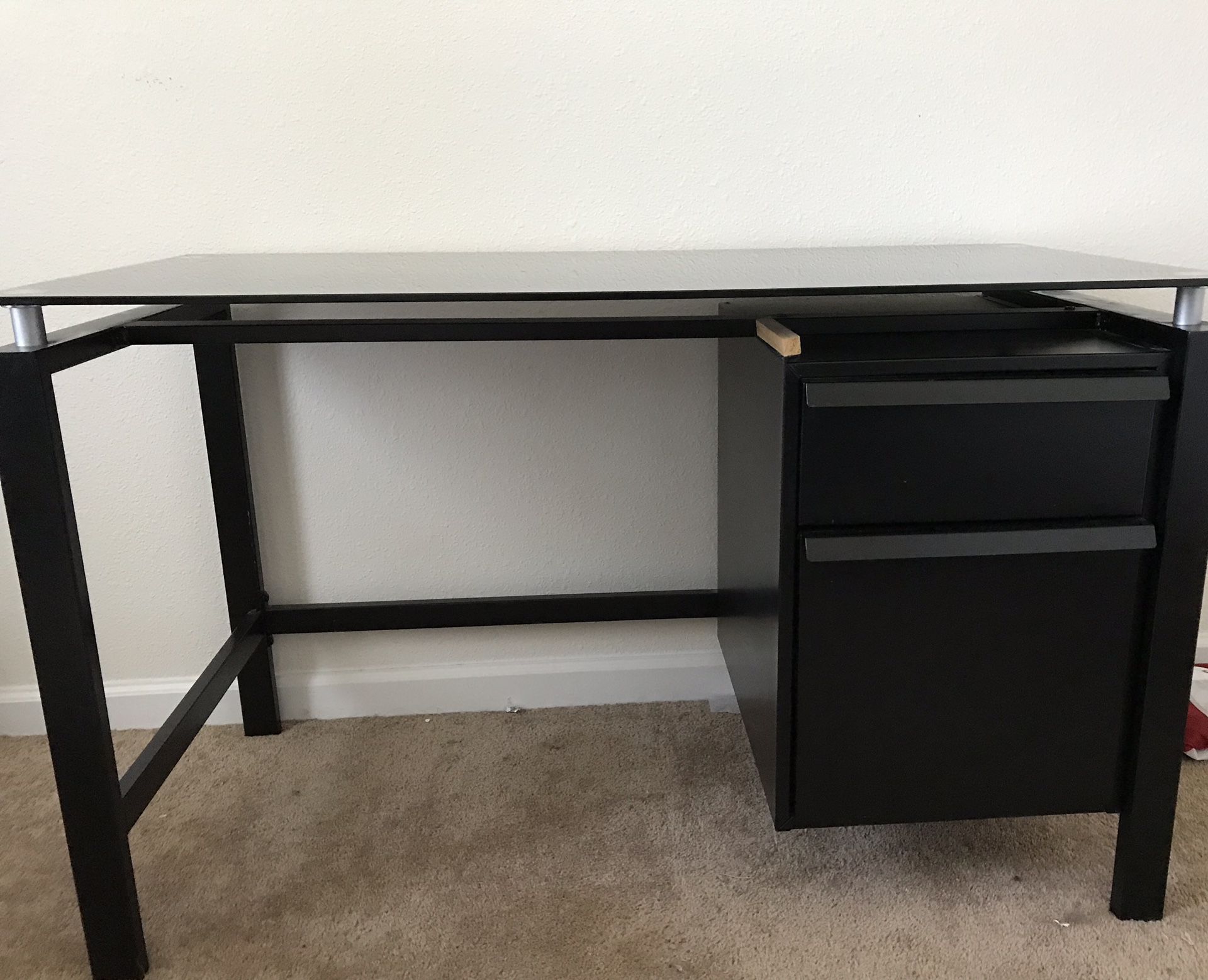Desk with glass top and metal body