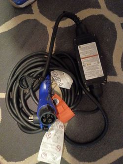 This is a Subaru OEM Level 1 portable EV charging cable (Part No. 29126AA000) designed for standard 110V/120V household outlets (12A).