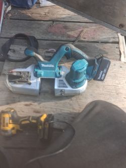 Peter Makita cordless band saw with a 5.0 amp hour 18 volt battery
