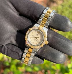 Tag Heuer WAF1450.BB0825 Ladies Aquaracer Quartz MOP Diamond dial Natural Diamond Bezel 18K Gold bracelet Watch Appraisal