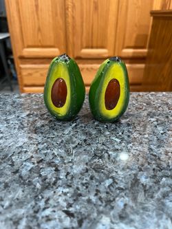 Vintage Ceramic Avocado Pair of Salt and Pepper Shakers.  Size approximately 3 inches tall.  Preowned one small scratch see pictures.