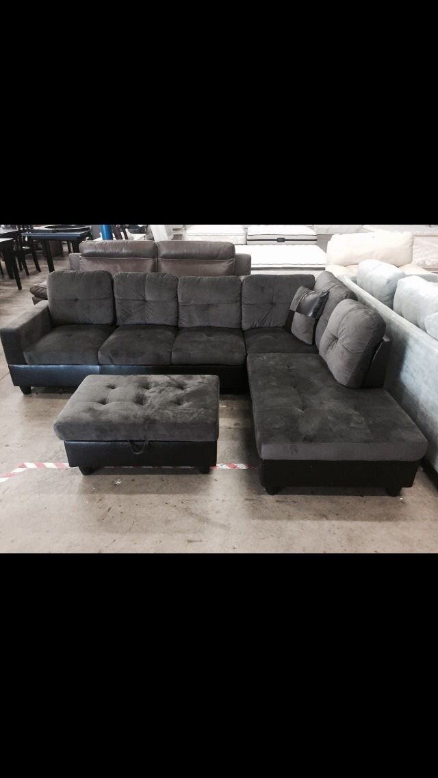 Dark grey microfiber sectional couch and ottoman