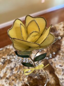 Yellow flower on stand