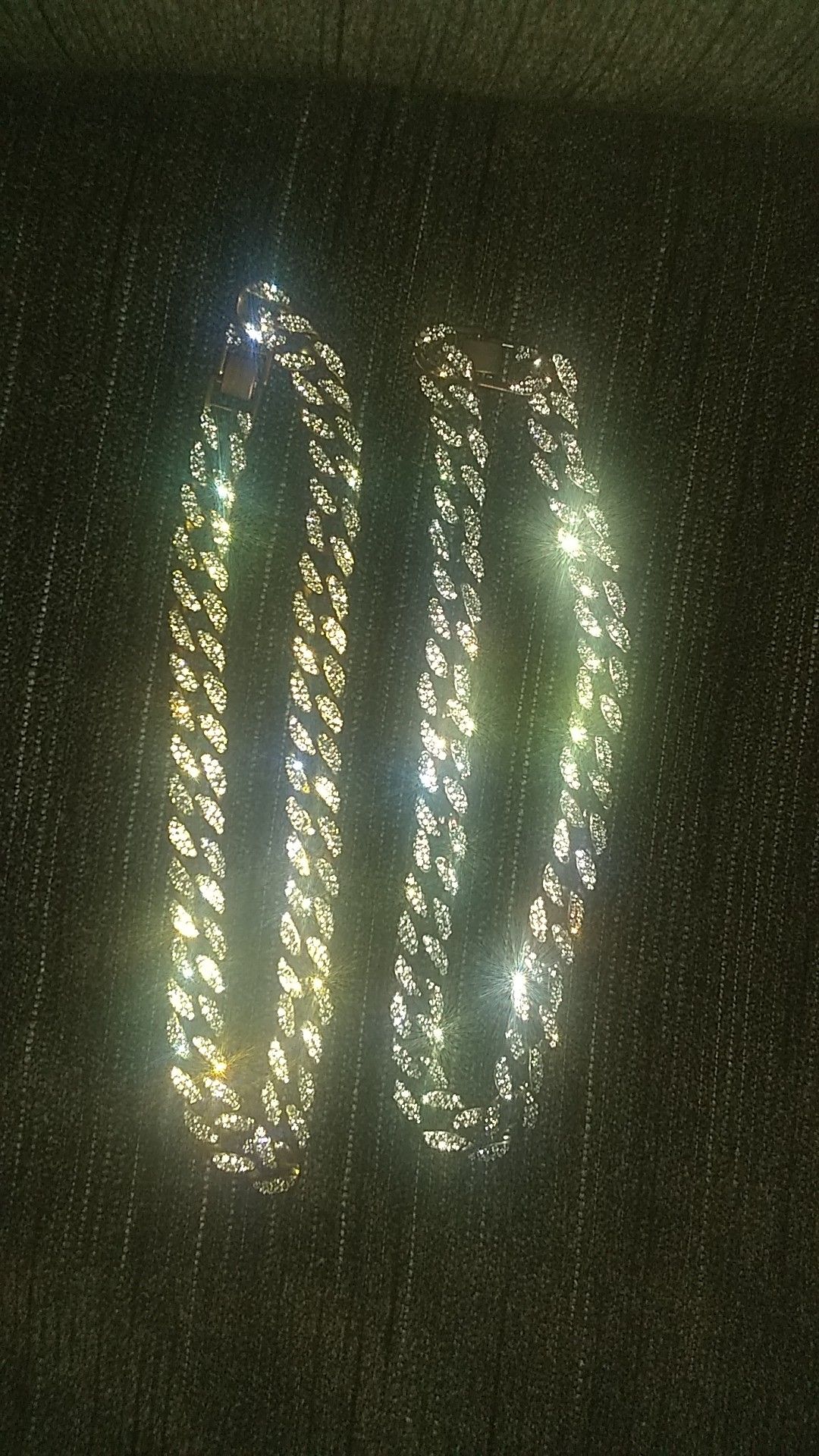 Two iced out Cuban chain links