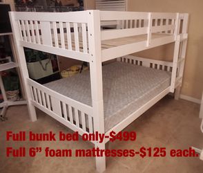 Full over Full bunk bed. Dark walnut,grey & white-$499. Full mattresses -$125.00 each. Assembly not included. Taxes included. Free delivery.  Se habla