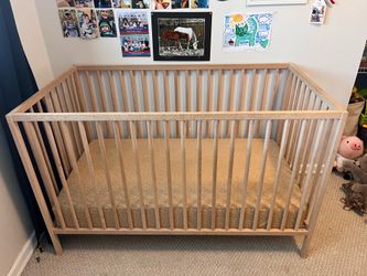 Natural wood IKEA crib and organic mattress