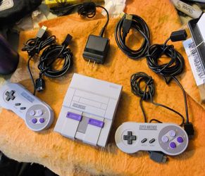 OEM mini super NES 21 built in games, two controllers with extensions tested and works awesome will not separate