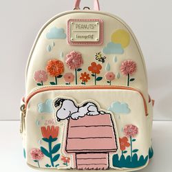 BRAND NEW WITH TAGS PEANUTS SNOOPY DOGHOUSE FLORAL LOUNGEFLY MINI BACKPACK FOR SALE. 