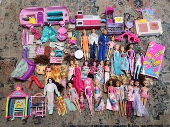Lots of barbies and accessories