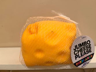 New squishy toy is a yellow cheese block from the SmushMart line by Crazy Fun. This item is made of a soft, squeezable material and is intended for ag