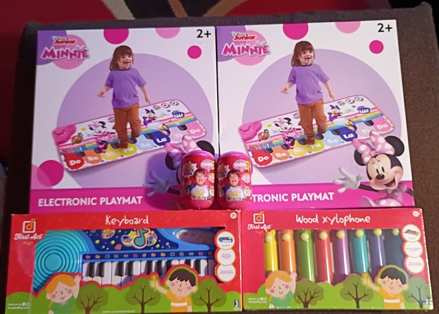 Minnie Mouse Electronic Play Mat, Wood XYLOPHONE, Keyboard, Ryan's World Squishy Mystery Figure 2 of Each. Value $130. For Only $60.