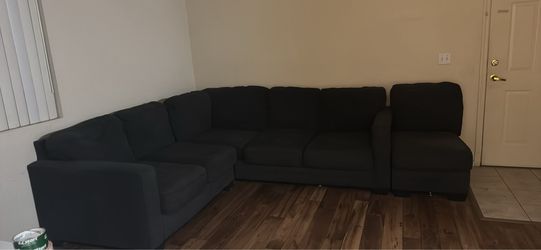 dark gray/black sectional couch