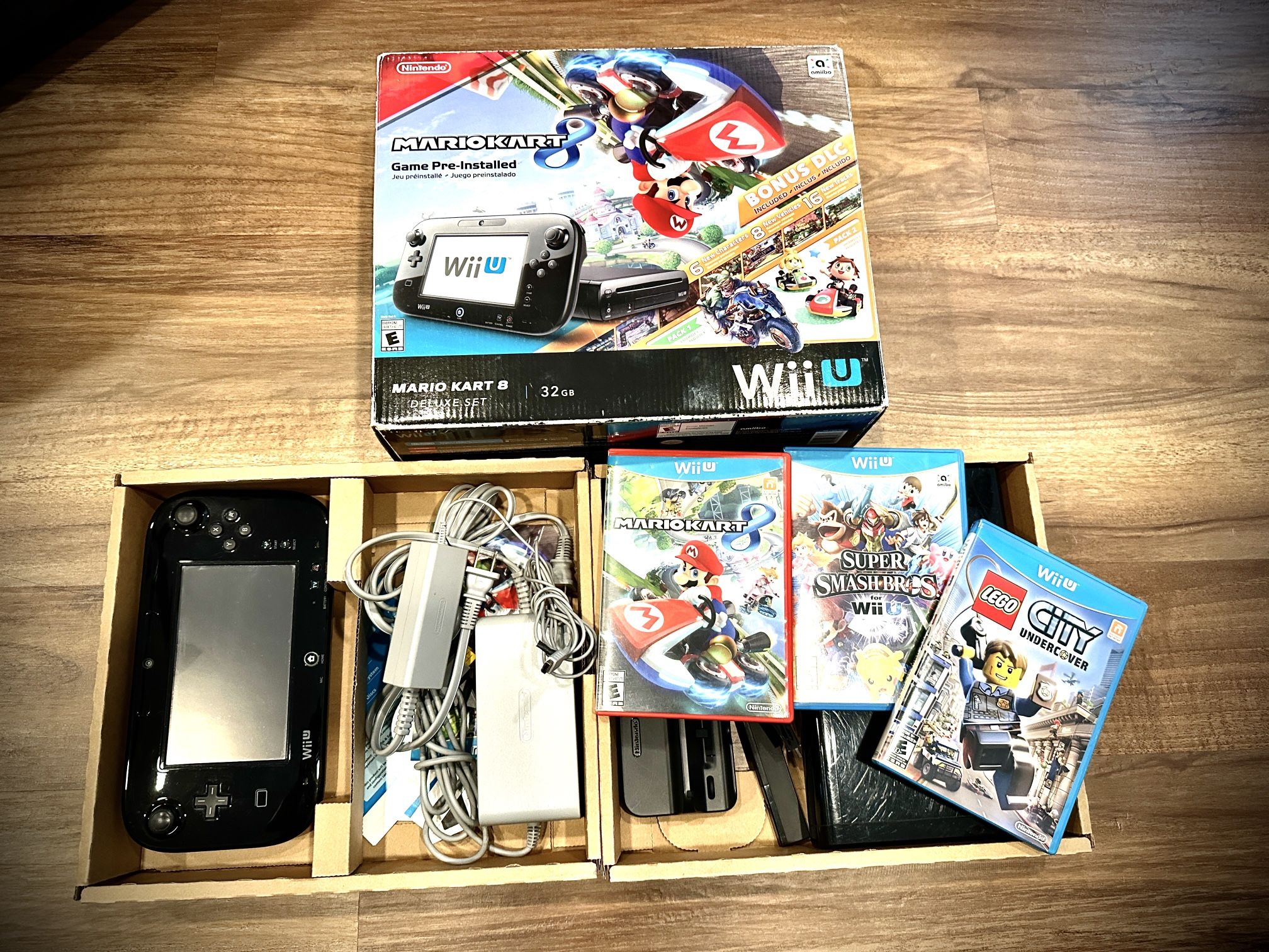Nintendo Wiiu Deluxe Console With 3 Videogames Mario Kart 8, Super Smash Bros, And Lego City Undercover