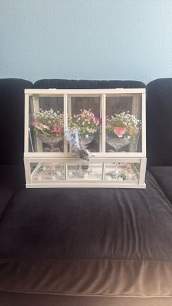 Vintage-Style Glass Display Case with Floral Arrangements