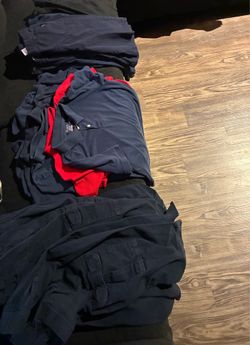 Free gently used boy school uniforms.  Size: 14 -16 (XL)   (6) pair of cargo pants (7) short sleeve shirts  (6) pair of shorts