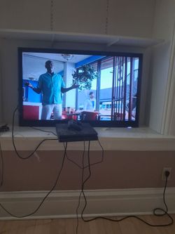 Tv, play,couch,mini fridge, table,bed