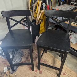 Two solid wood bar stools, seat 24 and 1/2 back 25 and 1/2