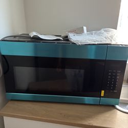 30 in. Over-the-Range Microwave in Stainless Steel with Dishwasher Safe Grease Filter and Vent