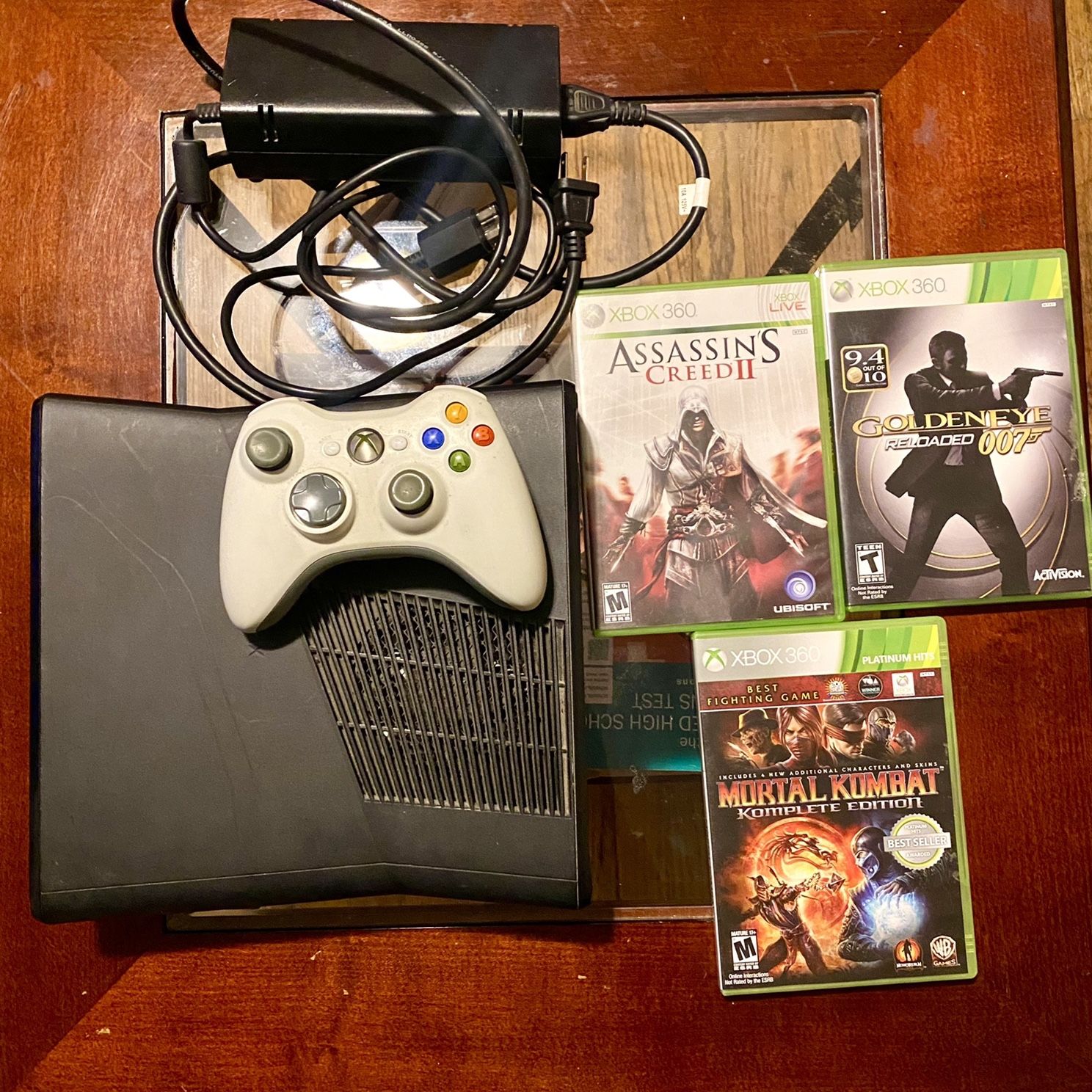 Assassins Creed & Mortal Kombat Xbox 360 Video Games 4 Included Perfect! -  video gaming - by owner - electronics media