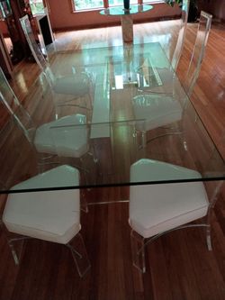 Three glass tables with 6 chairs