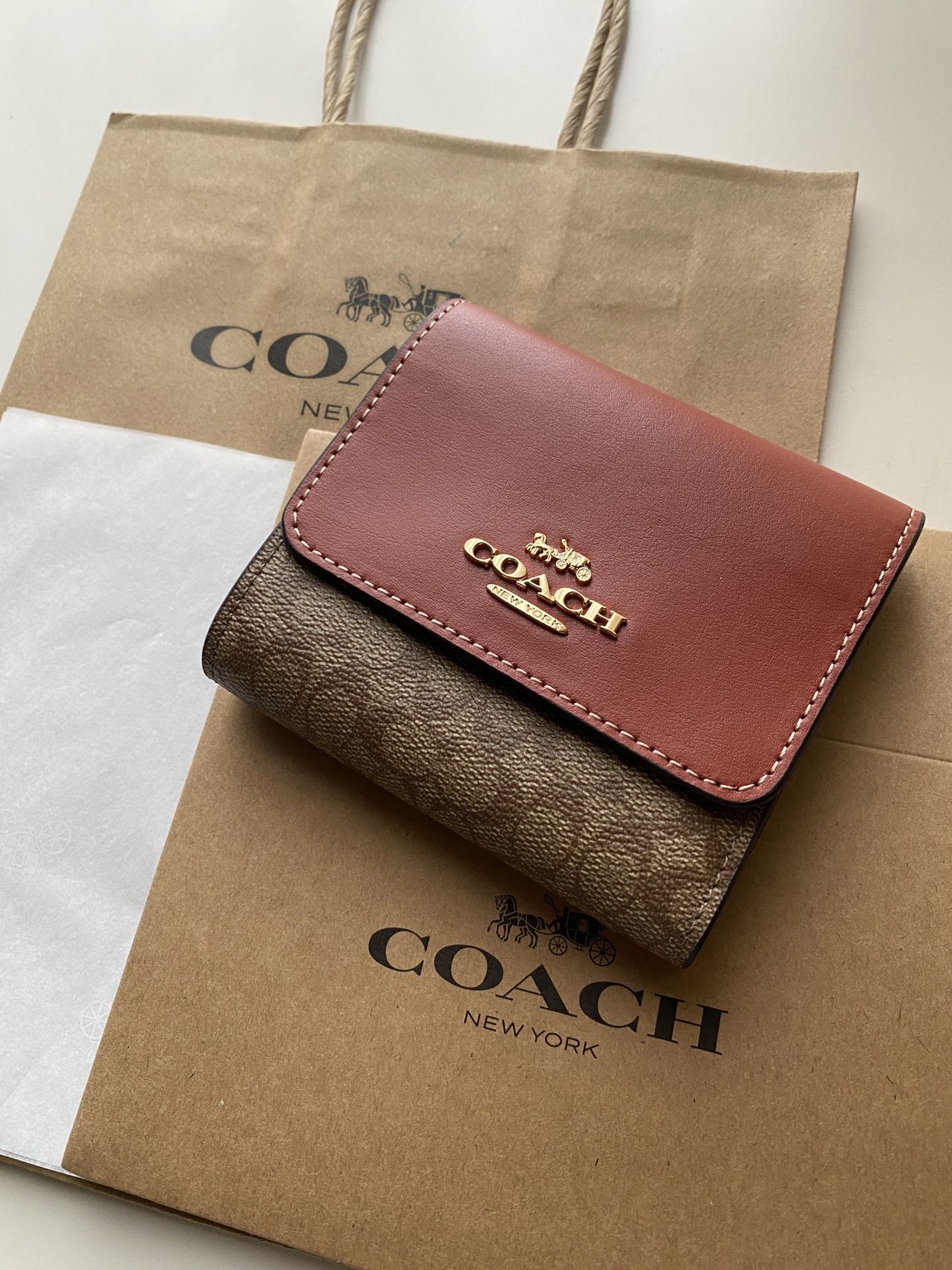 Coach small trifold Wallet in signature Canvas
