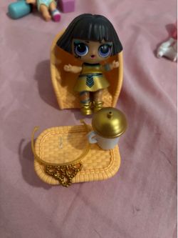 Lol doll with accessories and table set.