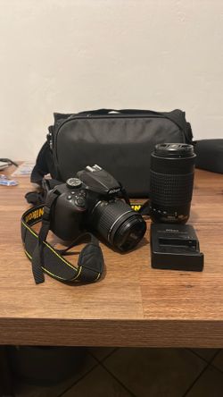 Nikon D3400 camera with two lens, and battery charger