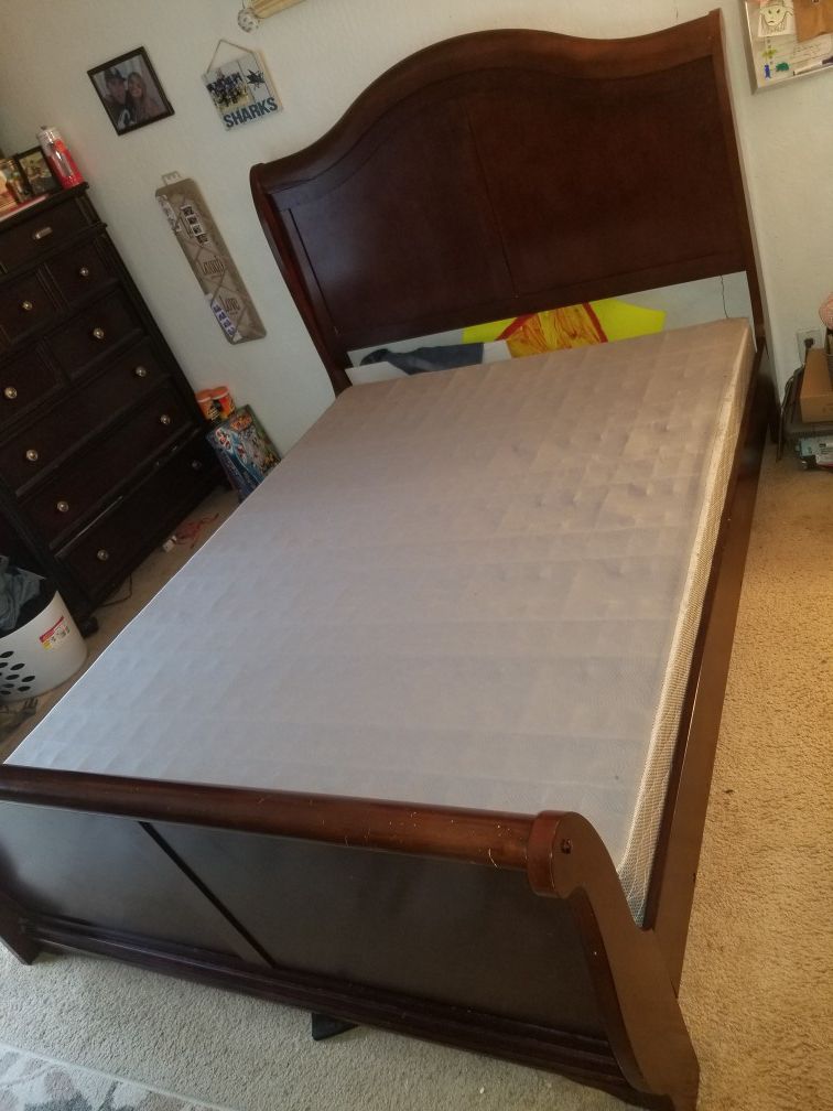 Queen bed frame with 1 year old box spring from big lots