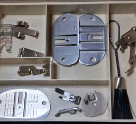 Singer Touch & Sew 750 throat plates, pattern disks, selection of presser feet