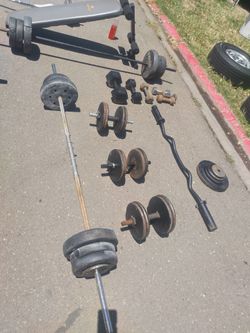 Lot's of weights and bars dumb bells