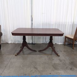 Reddish Brown Hardwood Dining Table with Rounded Corners