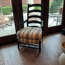 Black wood tall back arm chair with black and cream fabric  seat