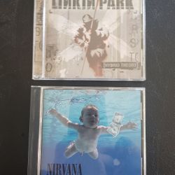 Nirvana: Nevermind and Linkin Park: Hybrid Theory CDs